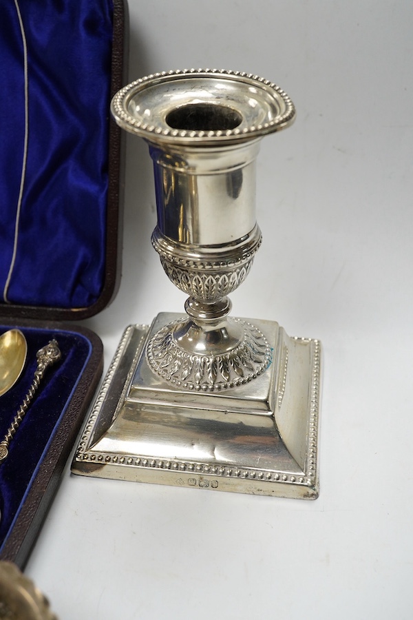 A pair of late Victorian silver dwarf candlesticks, Martin, Hall & Co, Sheffield, 1898, 11.4cm, weighted, a small pair of Irish silver salts, a silver butter shell and six other items including plated ware. Condition - p